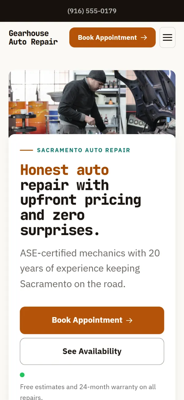 Warm auto repair website template on a phone: soft cards and warm colours under a wide photo