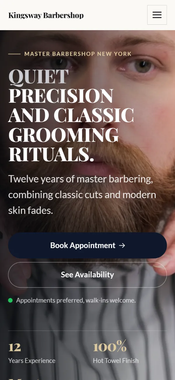 Luxury barbershop website template on a phone: dark and understated, with a serif headline over a full-width photo
