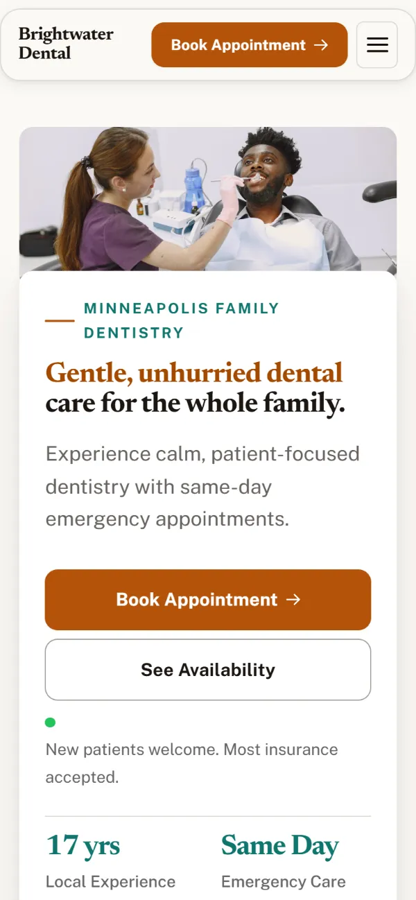 Warm dental website template on a phone: soft cards and warm colours under a wide photo