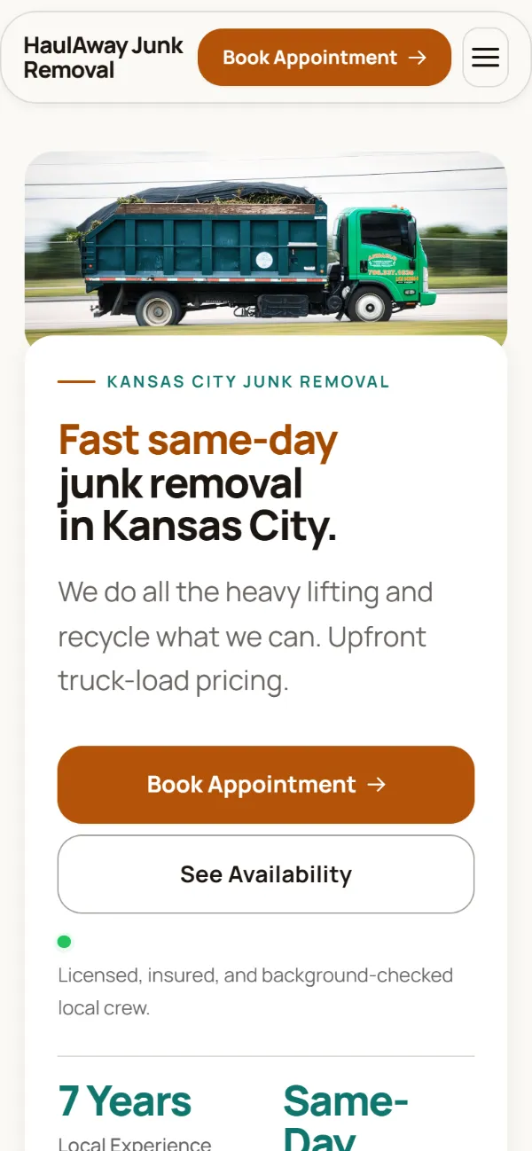 Warm junk removal website template on a phone: soft cards and warm colours under a wide photo