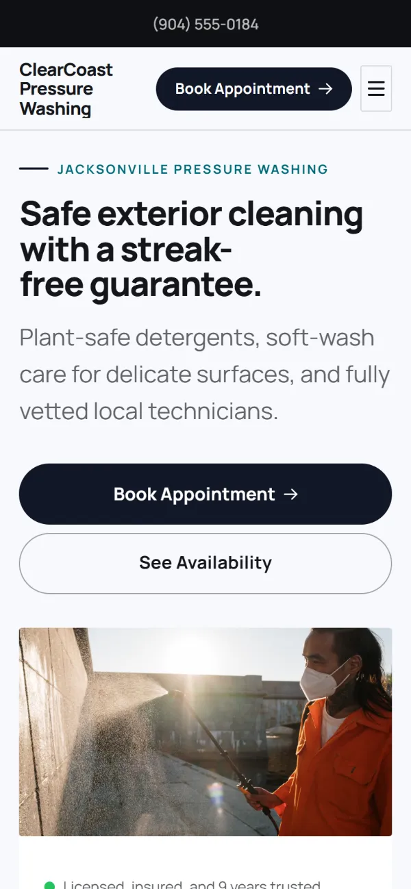 Bold pressure washing website template on a phone: a dark first screen, big capital headlines and one loud accent colour