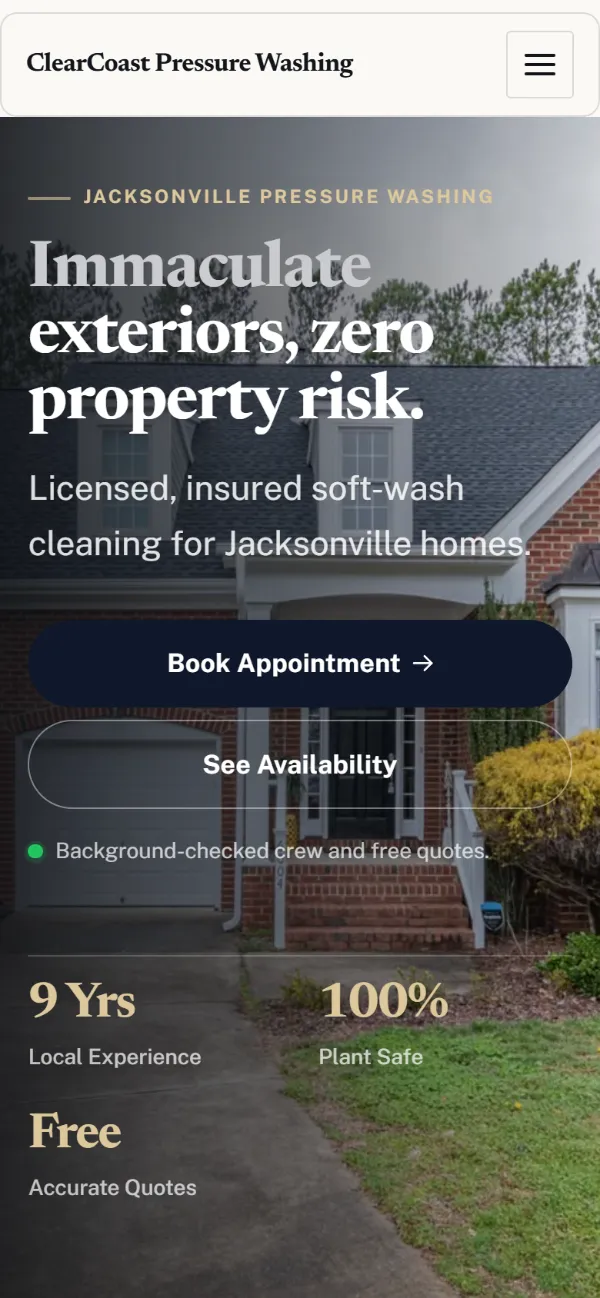Luxury pressure washing website template on a phone: dark and understated, with a serif headline over a full-width photo